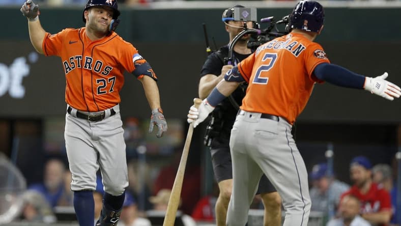 Oct 18, 2023; Arlington, Texas, USA; Houston Astros second baseman Jose Altuve (27) celebrates with third baseman Alex Bregman (2) after a solo home run during the third inning of game three of the ALCS against the Texas Rangers in the 2023 MLB playoffs at Globe Life Field. Mandatory Credit: Andrew Dieb-USA TODAY Sports