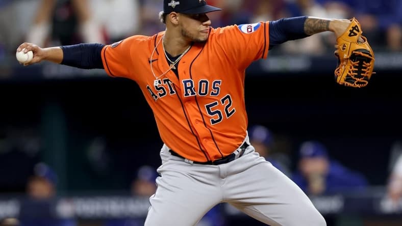 Oct 20, 2023; Arlington, Texas, USA; Houston Astros pitcher Bryan Abreu (52) throws during the eighth inning of game five in the ALCS against the Texas Rangers for the 2023 MLB playoffs at Globe Life Field. Mandatory Credit: Andrew Dieb-USA TODAY Sports