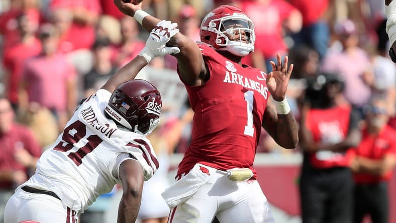 Oct 21, 2023; Fayetteville, Arkansas, USA;  Mississippi State Bulldogs defensive end Deonte Anderson (91) hits the arm of Arkansas Razorbacks quarterback KJ Jefferson (1) during the second half by at Donald W. Reynolds Razorback Stadium. Mississippi State won 7-3. Mandatory Credit: Nelson Chenault-USA TODAY Sports