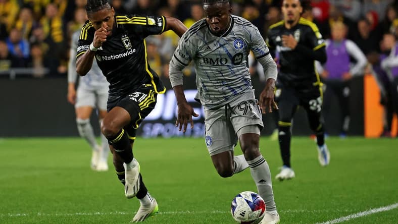 Oct 21, 2023; Columbus, Ohio, USA; CF Montreal forward Kwadwo Opoku (90) controls the ball against Columbus Crew defender Steven Moreira (31) during the second half at Lower.com Field. Mandatory Credit: Trevor Ruszkowski-USA TODAY Sports