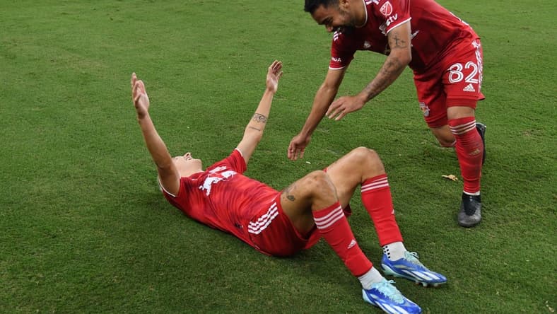 Oct 21, 2023; Nashville, Tennessee, USA; New York Red Bulls defender John Tolkin (47) celebrates with midfielder Luquinhas (82) after Tolkin   s goal in extra time against the Nashville SCat Geodis Park. Mandatory Credit: Christopher Hanewinckel-USA TODAY Sports