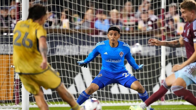 Oct 21, 2023; Commerce City, Colorado, USA; Real Salt Lake midfielder Diego Luna (26) shoots and scores on Colorado Rapids goalkeeper Abraham Rodriguez (26) and in the second half at Dick's Sporting Goods Park. Mandatory Credit: Ron Chenoy-USA TODAY Sports