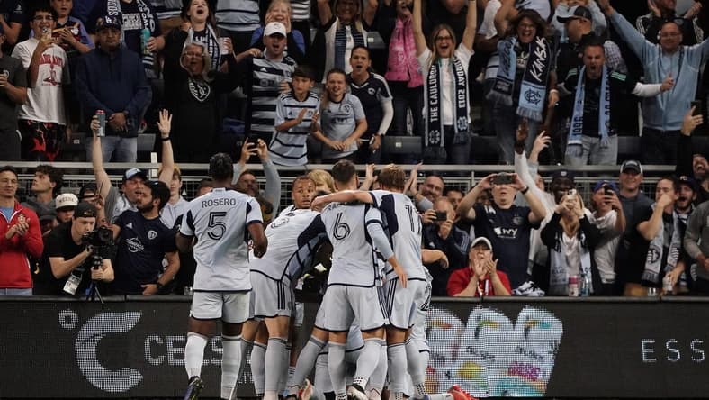 Oct 21, 2023; Kansas City, Kansas, USA; Sporting Kansas City forward Johnny Russell (7) celebrates with teammates after scoring a goal against Minnesota United during the first half at Children's Mercy Park. Mandatory Credit: Denny Medley-USA TODAY Sports