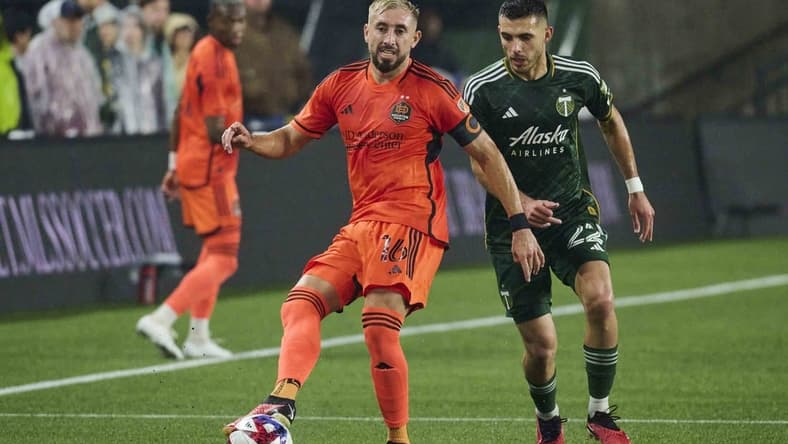 Oct 21, 2023; Portland, Oregon, USA; Houston Dynamo midfielder Hector Herrera (16) passes the ball against Portland Timbers midfielder Cristhian Paredes (22) during the first half at Providence Park. Mandatory Credit: Troy Wayrynen-USA TODAY Sports