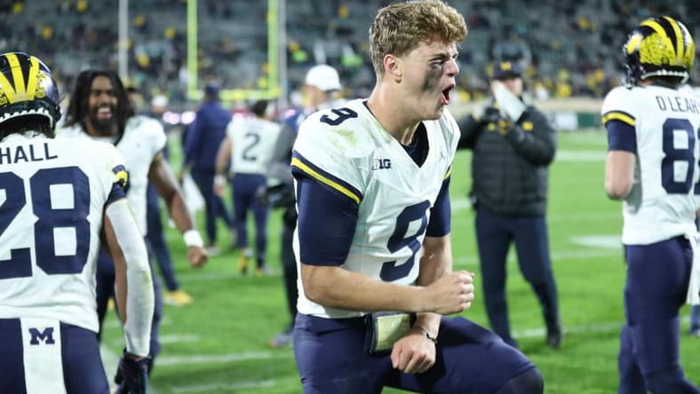 Michigan Wolverines quarterback J.J. McCarthy (9) celebrates after a touchdown against the Michigan State Spartans during second-half action at Spartan Stadium in East Lansing on Saturday, Oct. 21, 2023.