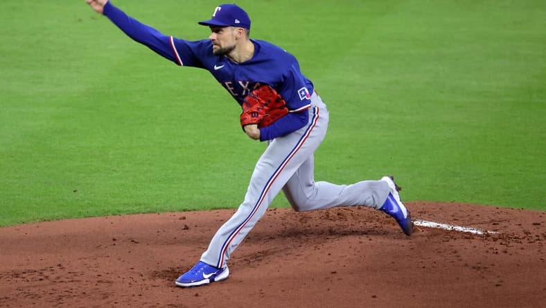 Oct 22, 2023; Houston, Texas, USA; Texas Rangers starting pitcher Nathan Eovaldi (17) throws a pitch against the Houston Astros in the first inning during game six of the ALCS for the 2023 MLB playoffs at Minute Maid Park. Mandatory Credit: Erik Williams-USA TODAY Sports