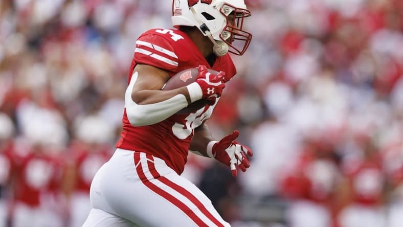 Oct 14, 2023; Madison, Wisconsin, USA;  Wisconsin Badgers running back Jackson Acker (34) during the game against the Iowa Hawkeyes at Camp Randall Stadium. Mandatory Credit: Jeff Hanisch-USA TODAY Sports