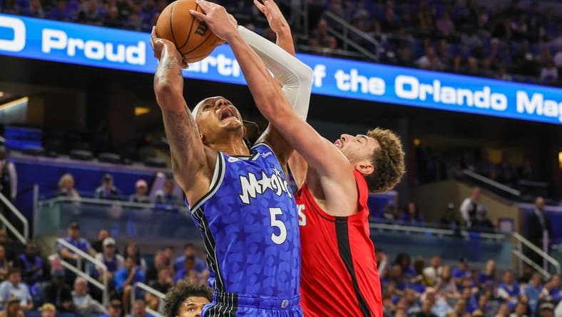 Oct 25, 2023; Orlando, Florida, USA; Orlando Magic forward Paolo Banchero (5) is fouled by Houston Rockets center Alperen Sengun (28) during the first quarter at Amway Center. Mandatory Credit: Mike Watters-USA TODAY Sports