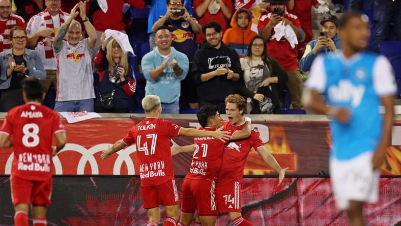 Oct 25, 2023; Harrison, NJ, USA; New York Red Bulls forward Tom Barlow (74) celebrates with midfielder Omir Fernandez (21) after scoring a goal against Charlotte FC during the second half in the Eastern Conference Wild Card match of the 2023 MLS Cup Playoffs at Red Bull Arena. Mandatory Credit: Vincent Carchietta-USA TODAY Sports