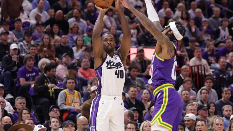 Oct 25, 2023; Salt Lake City, Utah, USA; Sacramento Kings forward Harrison Barnes (40) shoots the ball past Utah Jazz guard Jordan Clarkson (00) during the first quarter at Delta Center. Mandatory Credit: Chris Nicoll-USA TODAY Sports