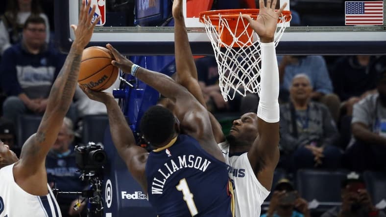 Oct 25, 2023; Memphis, Tennessee, USA; Memphis Grizzlies forward-center Jaren Jackson Jr. (13) defends as New Orleans Pelicans forward Zion Williamson (1) drives to the basket during the first half at FedExForum. Mandatory Credit: Petre Thomas-USA TODAY Sports