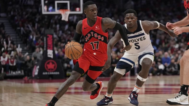 Oct 25, 2023; Toronto, Ontario, CAN; Toronto Raptors guard Dennis Schroder (17) drives to the net past Minnesota Timberwolves guard Anthony Edwards (5) during the second half at Scotiabank Arena. Mandatory Credit: John E. Sokolowski-USA TODAY Sports