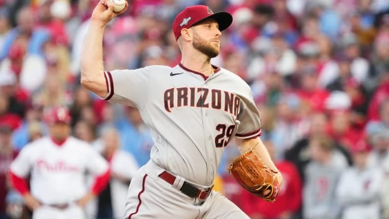 Arizona Diamondbacks starting pitcher Merrill Kelly (29) pitches during the first inning against the Philadelphia Phillies in Game 6 of the NLCS at Citizens Bank Park on Oct. 23, 2023, in Philadelphia, PA. The Arizona Diamondbacks won Game 6 of the NLCS against the Philadelphia Phillies, 5-1.