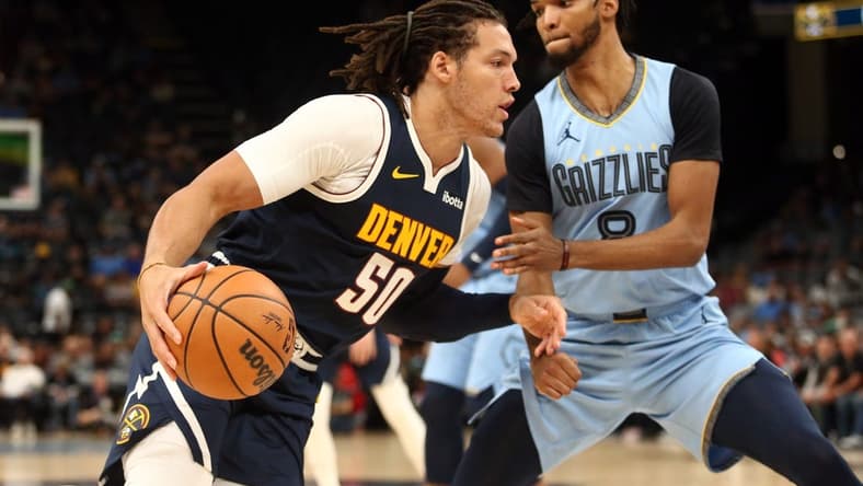 Oct 27, 2023; Memphis, Tennessee, USA; Denver Nuggets forward Aaron Gordon (50) moves to the basket as Memphis Grizzlies forward Ziaire Williams (8) defends during the first half at FedExForum. Mandatory Credit: Petre Thomas-USA TODAY Sports
