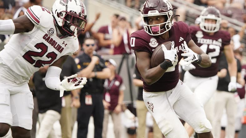 Oct 28, 2023; College Station, Texas, USA; Texas A&M Aggies wide receiver Ainias Smith (0) runs for a touchdown against the South Carolina Gamecocks during the second quarter at Kyle Field. Mandatory Credit: Dustin Safranek-USA TODAY Sports
