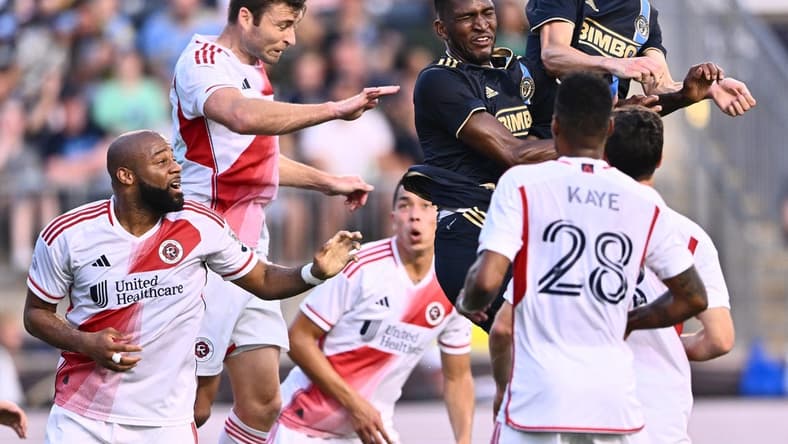 Oct 28, 2023; Philadelphia, PA, USA; New England Revolution defender Dave Romney (2) goes up for a header with Philadelphia Union defender Damion Lowe (17) and Philadelphia Union defender Jack Elliott (3) during the first half in game one in a round one match of the 2023 MLS Cup Playoffs at Subaru Park. Mandatory Credit: Kyle Ross-USA TODAY Sports