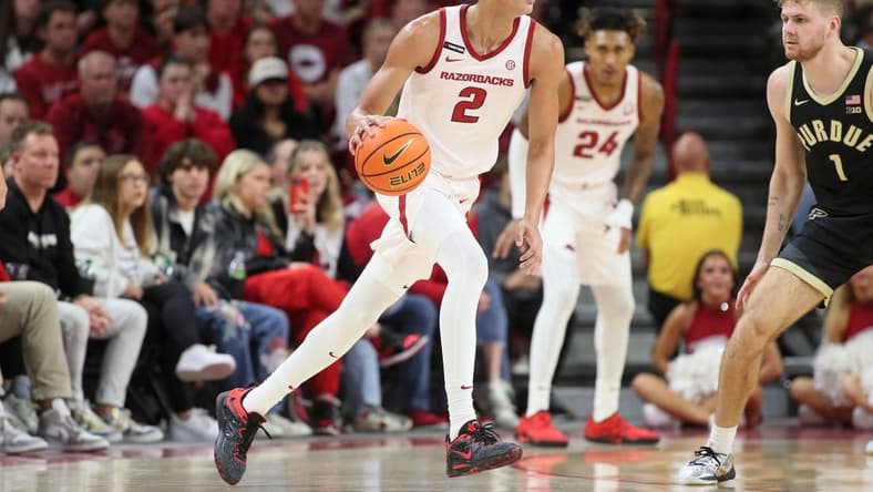 Arkansas Razorbacks forward Trevon Brazile (2) dribbles the ball against Purdue Boilermakers forward Caleb First (1) during the first half at Bud Walton Arena. Arkansas won 81-77. Mandatory Credit: Nelson Chenault-USA TODAY Sports