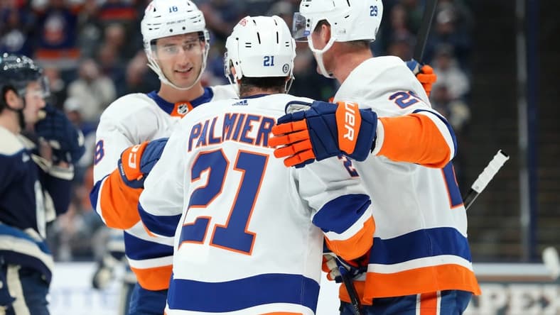 Oct 28, 2023; Columbus, Ohio, USA; New York Islanders center Kyle Palmieri (21) celebrates his goal with center Brock Nelson (29) and left wing Pierre Engvall (18) during the first period against the Columbus Blue Jackets at Nationwide Arena. Mandatory Credit: Joseph Maiorana-USA TODAY Sports