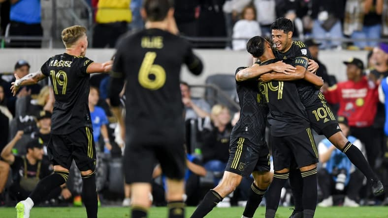 Oct 28, 2023; Los Angeles, CA, USA; Los Angeles FC forward Denis Bouanga (99) celebrates with teammates after scoring a goal against the Vancouver Whitecaps FC in the first half of game one in a round one match of the 2023 MLS Cup Playoffs at BMO Stadium. Mandatory Credit: Jonathan Hui-USA TODAY Sports