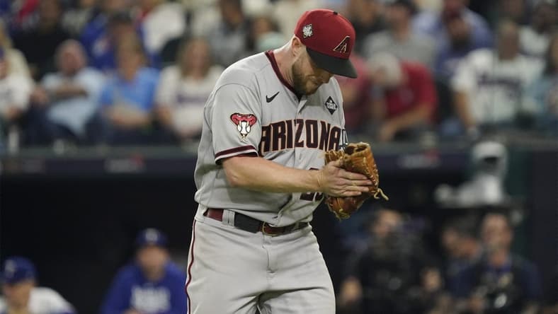 Oct 28, 2023; Arlington, TX, USA; Arizona Diamondbacks relief pitcher Merrill Kelly (29) reacts in the in the seventh inning against the Texas Rangers in game two of the 2023 World Series at Globe Life Field. Mandatory Credit: Raymond Carlin III-USA TODAY Sports