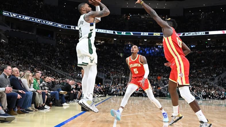 Oct 29, 2023; Milwaukee, Wisconsin, USA; Milwaukee Bucks guard Damian Lillard (0) puts up a shot agains the Atlanta Hawks in the second quarter at Fiserv Forum. Mandatory Credit: Michael McLoone-USA TODAY Sports