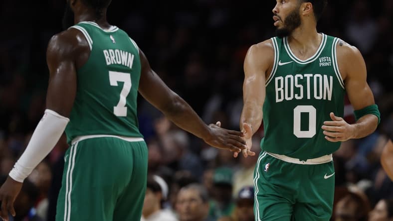 Oct 30, 2023; Washington, District of Columbia, USA; Boston Celtics forward Jayson Tatum (0) celebrates with Celtics guard Jaylen Brown (7) against the Washington Wizards in the third quarter at Capital One Arena. Mandatory Credit: Geoff Burke-USA TODAY Sports