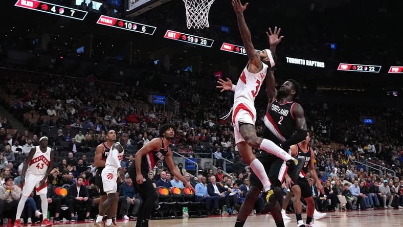 Oct 30, 2023; Toronto, Ontario, CAN; Toronto Raptors guard Gary Trent Jr. (33) drives to the basket over Portland Trail Blazers center Deandre Ayton (2) during the fourth quarter at Scotiabank Arena. Mandatory Credit: Nick Turchiaro-USA TODAY Sports