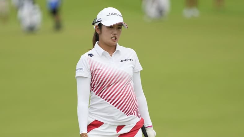 Aug 7, 2021; Tokyo, Japan; Mone Inami (JPN) reacts after her putt on the 18th hole during the final round of the women's individual stroke play of the Tokyo 2020 Olympic Summer Games at Kasumigaseki Country Club. Mandatory Credit: Michael Madrid-USA TODAY Sports