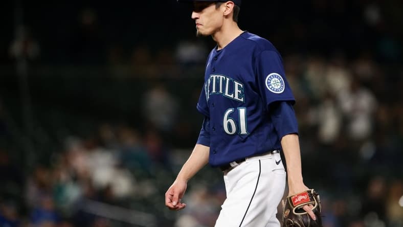 May 7, 2022; Seattle, Washington, USA; Seattle Mariners relief pitcher Riley O'Brien (61) walks off the field after pitching in the ninth inning against the Tampa Bay Rays at T-Mobile Park. Mandatory Credit: Lindsey Wasson-USA TODAY Sports