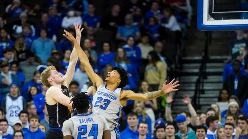 Nov 17, 2022; Omaha, Nebraska, USA; UC Riverside Highlanders forward Wil Tattersall (14) puts up a shot against Creighton Bluejays guard Trey Alexander (23) during the second half at CHI Health Center Omaha. Mandatory Credit: Dylan Widger-USA TODAY Sports