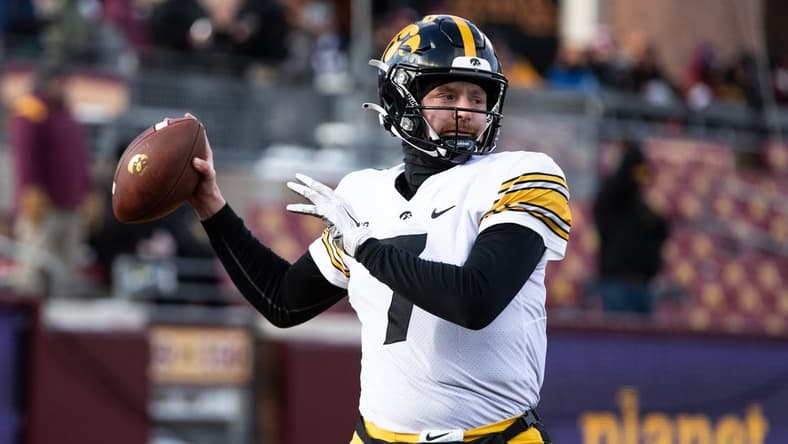 Nov 19, 2022; Minneapolis, Minnesota, USA; Iowa Hawkeyes quarterback Spencer Petras (7) warms up before the game against the Minnesota Golden Gophers at Huntington Bank Stadium. Mandatory Credit: Matt Krohn-USA TODAY Sports