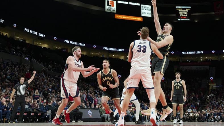 Nov 25, 2022; Portland, Oregon, USA;  Purdue Boilermakers center Zach Edey (15) shoots a basket during the second half against Gonzaga Bulldogs forward Ben Gregg (33) at Moda Center. Purdue won the game 84-66. Mandatory Credit: Troy Wayrynen-USA TODAY Sports