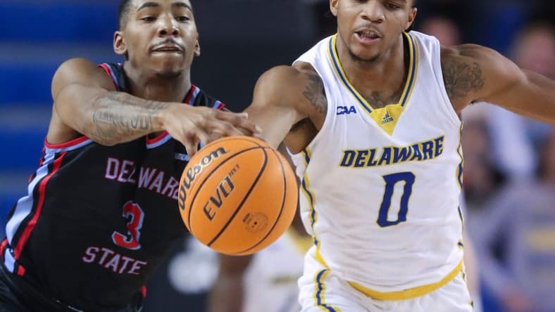 Delaware State's Martaz Robinson moves too late to stop Delaware's Jameer Nelson Jr. from getting to a loose ball  in the first half of the Blue Hens' 77-69 win at the Bob Carpenter Center, Wednesday, Dec. 7, 2022.

Ncaa Basketball Wil Hens Hornets Hoops Delaware State At Delaware