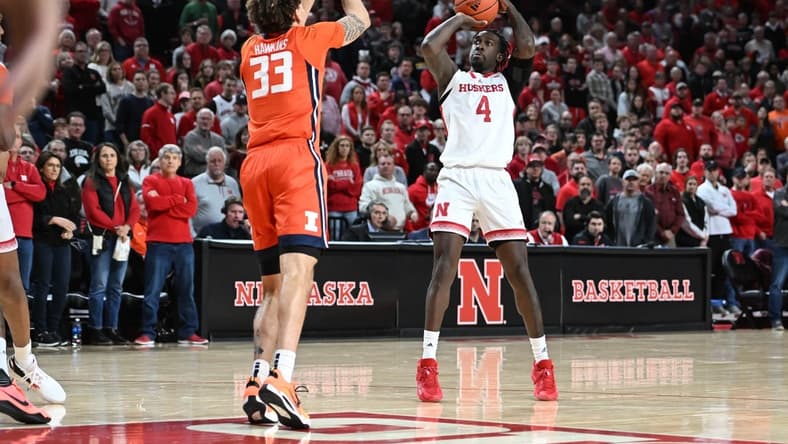 Jan 10, 2023; Lincoln, Nebraska, USA;  Nebraska Cornhuskers forward Juwan Gary (4) attempts a shot over Illinois Fighting Illini forward Coleman Hawkins (33) in the first half at Pinnacle Bank Arena. Mandatory Credit: Steven Branscombe-USA TODAY Sports