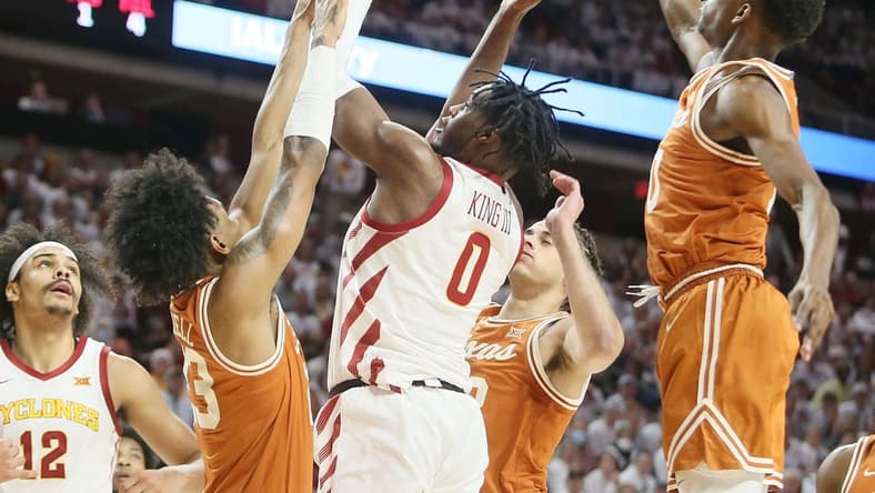 Iowa State University Cyclones forward Tre King (0) takes a shot around Texas Longhorns guard Gavin Perryman (13),  forward Timmy Allen (0), and guard Arterio Morris (2) during the first half at Hilton Coliseum Tuesday, Jan. 17, 2022, in Ames, Iowa.  Photo by Nirmalendu Majumdar/Ames Tribune

Texas And Iowa State Men S Basketball
