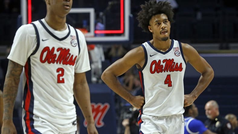 Jan 31, 2023; Oxford, Mississippi, USA; Mississippi Rebels guard TJ Caldwell (2) and forward Jaemyn Brakefield (4) walk off the court after losing to the Kentucky Wildcats at The Sandy and John Black Pavilion at Ole Miss. Mandatory Credit: Petre Thomas-USA TODAY Sports