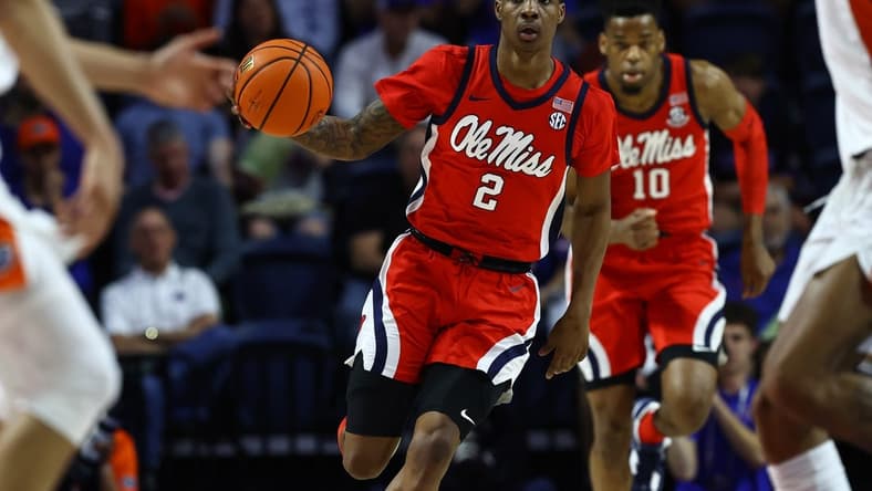 Feb 15, 2023; Gainesville, Florida, USA; Mississippi Rebels guard TJ Caldwell (2) dribbles the ball against the Florida Gators during the first half at Exactech Arena at the Stephen C. O'Connell Center. Mandatory Credit: Kim Klement-USA TODAY Sports