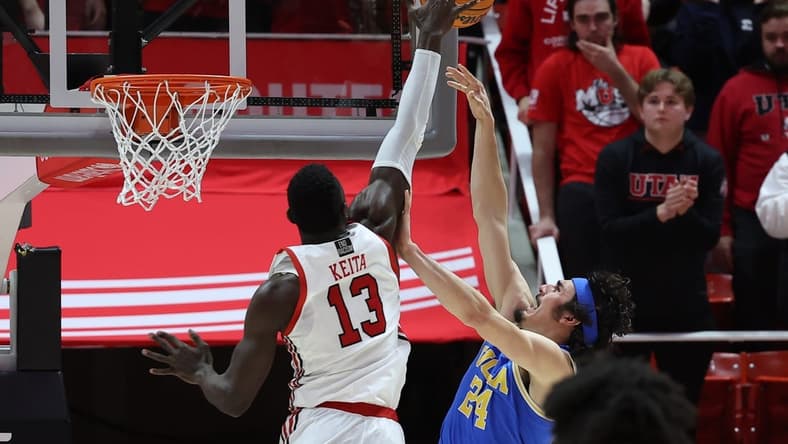 Feb 23, 2023; Salt Lake City, Utah, USA; Utah Utes center Keba Keita (13) blocks the shot of UCLA Bruins guard Jaime Jaquez Jr. (24) in the second half at Jon M. Huntsman Center. Mandatory Credit: Rob Gray-USA TODAY Sports