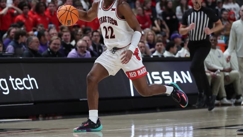 Feb 25, 2023; Lubbock, Texas, USA; Texas Tech Red Raiders guard Elijah Fisher (22) brings the ball up court against the TCU Horned Frogs in the second half at United Supermarkets Arena. Mandatory Credit: Michael C. Johnson-USA TODAY Sports