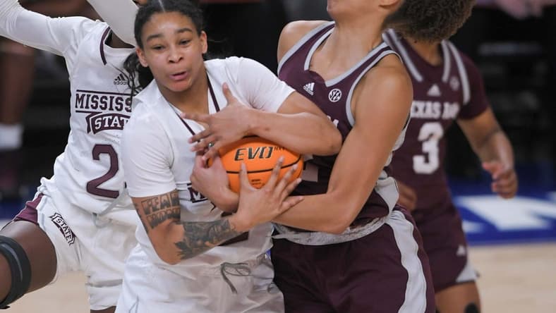 Mississippi State forward Ramani Parker (23) and Texas A&M forward Jada Malone (13) reach for a ball during the first quarter of the SEC Women's Basketball Tournament at Bon Secours Wellness Arena in Greenville, S.C. Thursday, March 2, 2023.

Texas A M Vs Mississippi State 2023 Sec Women S Basketball Tournament In Greenville Sc
