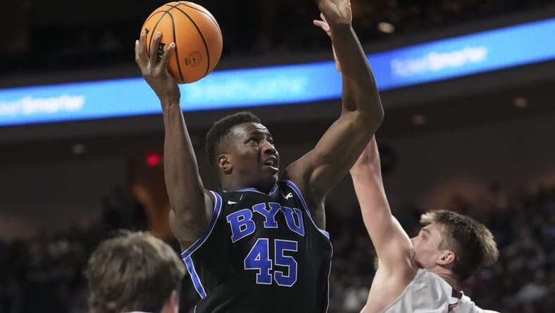 March 6, 2023; Las Vegas, NV, USA; Brigham Young Cougars forward Fousseyni Traore (45) shoots the basketball against Saint Mary's Gaels center Mitchell Saxen (11) during the second half in the semifinals of the WCC Basketball Championships at Orleans Arena. Mandatory Credit: Kyle Terada-USA TODAY Sports