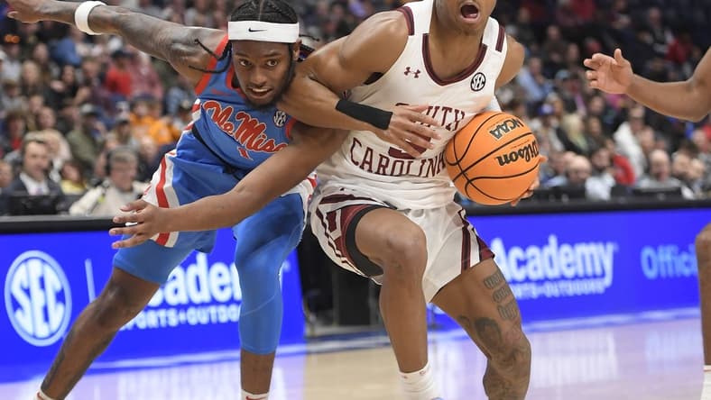 Mar 8, 2023; Nashville, TN, USA;  South Carolina Gamecocks guard Meechie Johnson (5) drives past Mississippi Rebels guard Amaree Abram (1) during the second half at Bridgestone Arena. Mandatory Credit: Steve Roberts-USA TODAY Sports