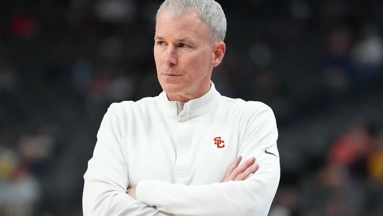 Mar 9, 2023; Las Vegas, NV, USA; USC Trojans head coach Andy Enfield watches play against the Arizona State Sun Devils during the second period at T-Mobile Arena. Mandatory Credit: Stephen R. Sylvanie-USA TODAY Sports