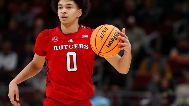 Rutgers Scarlet Knights guard Derek Simpson (0) drives to the basket during the Big Ten Men   s Basketball Tournament game against the Purdue Boilermakers, Friday, March 10, 2023, at United Center in Chicago. Purdue Boilermakers won 70-65.

Purrut031023 Am14298