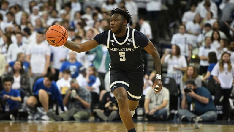Mar 1, 2023; Omaha, Nebraska, USA;  Georgetown Hoyas guard Jay Heath (5) dribbles against the Creighton Bluejays in the first half at CHI Health Center Omaha. Mandatory Credit: Steven Branscombe-USA TODAY Sports