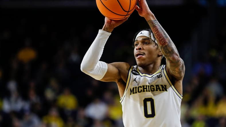 Michigan guard Dug McDaniel (0) makes a pass against Toledo during the first half of the first round of the NIT at Crisler Center in Ann Arbor on Tuesday, March 14, 2023.