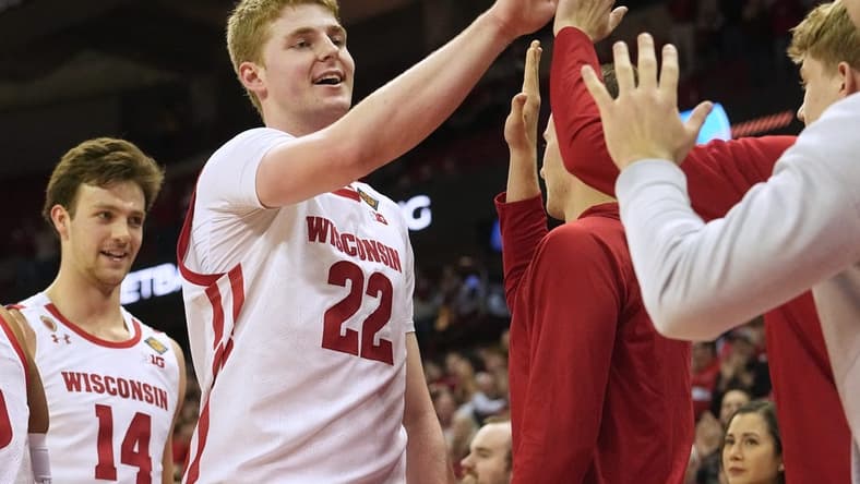 Wisconsin forward Steven Crowl (22) is congratulated by teammates during the second half of their opening round game of the National Invitation Tournament Tuesday, March 14, 2023 at the Kohl Center in Madison, Wis. Crowl scored a career high 36 points. Wisconsin beat Bradley 81-62.

Uwmen14 13