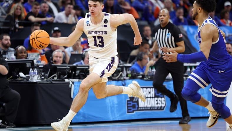 Mar 16, 2023; Sacramento, CA, USA; Northwestern Wildcats guard Brooks Barnhizer (13) controls the ball against Boise State Broncos guard Marcus Shaver Jr. (10) in the second half at Golden 1 Center. Mandatory Credit: Kelley L Cox-USA TODAY Sports