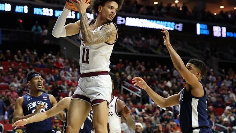 Mar 16, 2023; Des Moines, IA, USA; Texas A&M Aggies forward Andersson Garcia (11) grabs the ball against the Penn State Nittany Lions during the first half at Wells Fargo Arena. Mandatory Credit: Reese Strickland-USA TODAY Sports