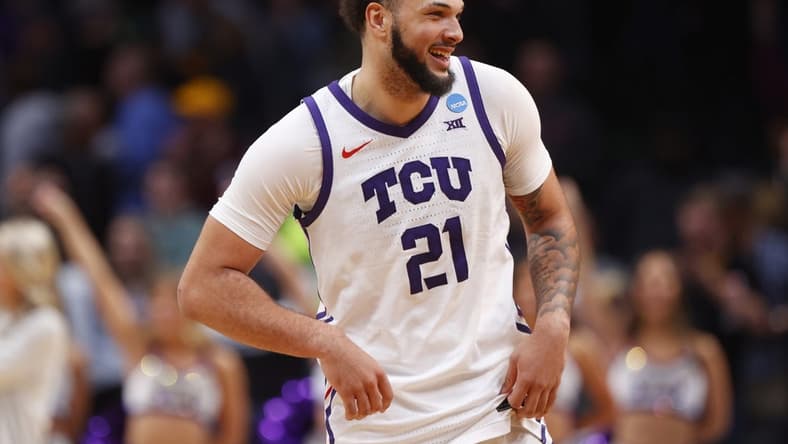 Mar 17, 2023; Denver, CO, USA; TCU Horned Frogs forward JaKobe Coles (21) reacts after defeating the Arizona State Sun Devils in the first round of the NCAA tournament at Ball Arena. Mandatory Credit: Michael Ciaglo-USA TODAY Sports